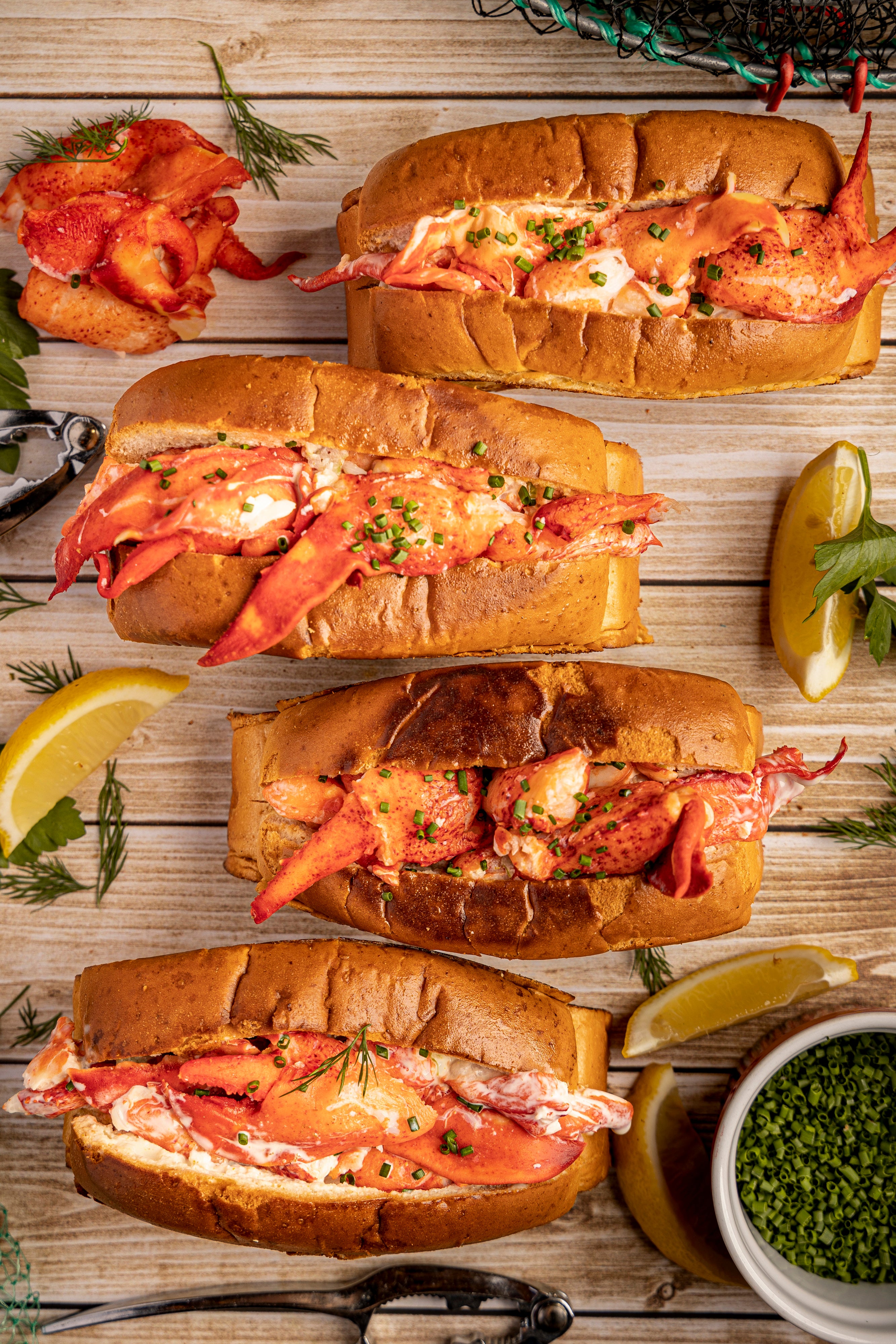 Four Lobster Rolls from Lobster Boss Hong Kong. Lobster Rolls are in a vertical row